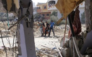 Palestinians carry the bodies of fellow Palestinians in the east of Khan Younis