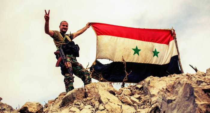 SYrian soldier with flag