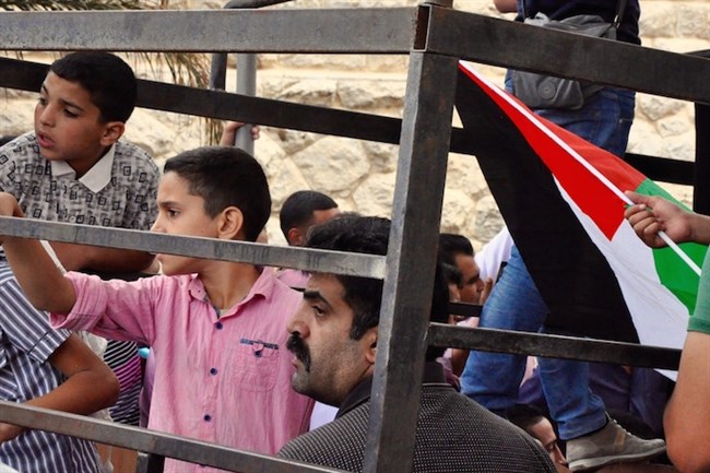 The father of Abdelrahman Obeidallah waits for his son's body to be brought to the family. (MaanImages/Emily Mulder)